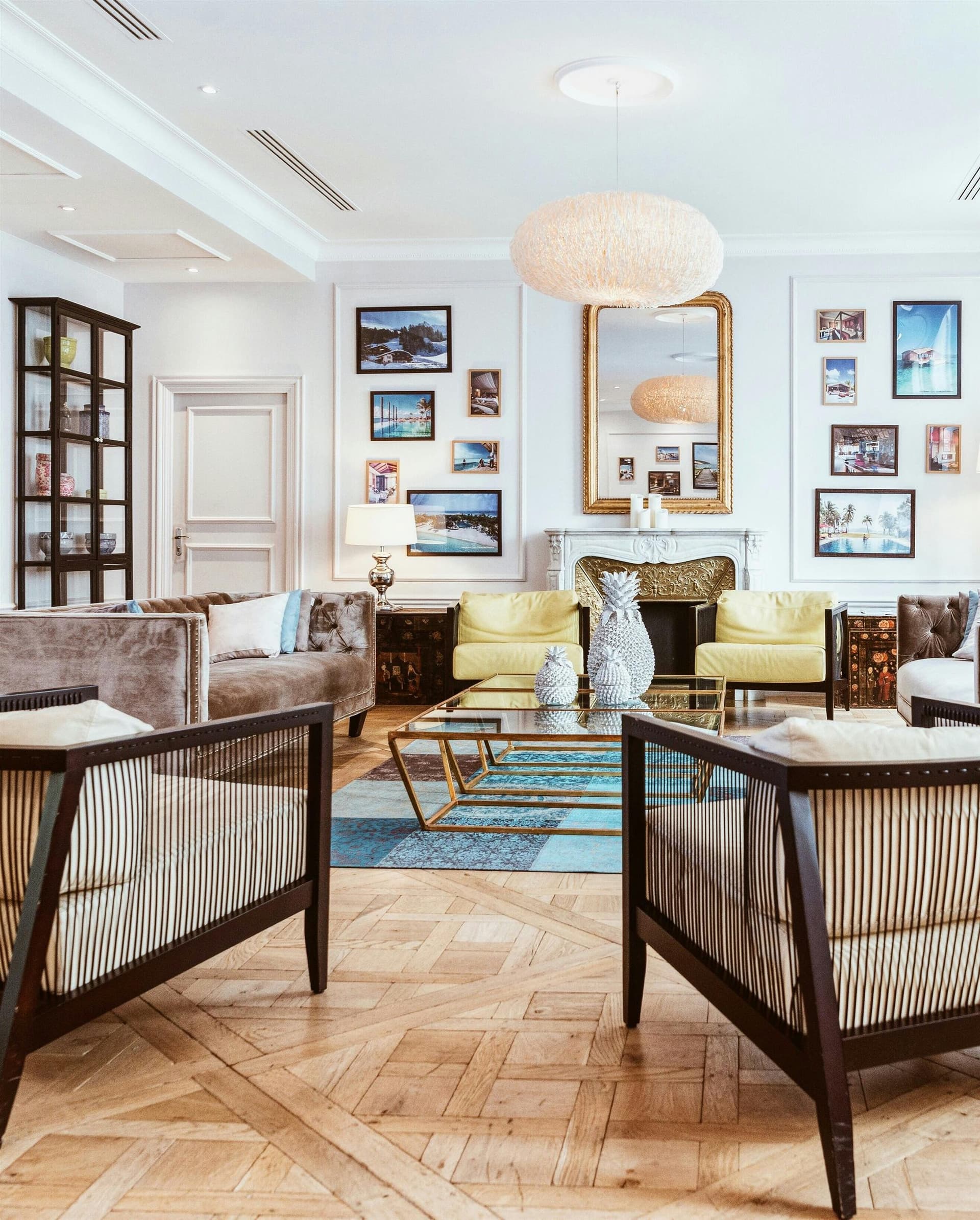 A luxurious high-end residential living room overlooking a misty highland landscape.
